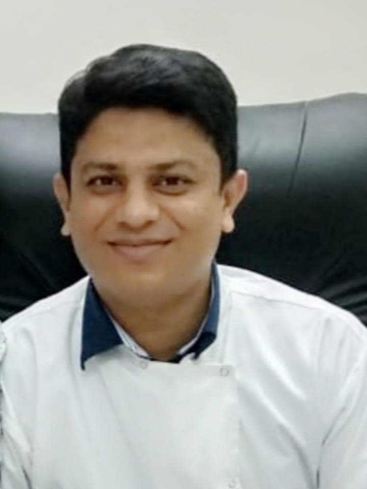 Dr. Mukesh Chute, periodontist and oral implantologist, at his Kothrud clinic